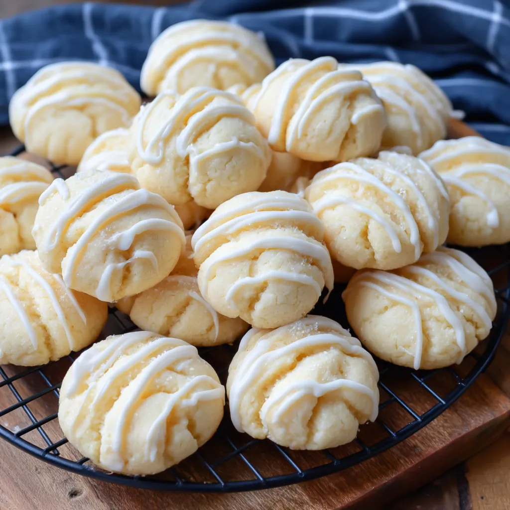 A plate of cookies with white icing.
