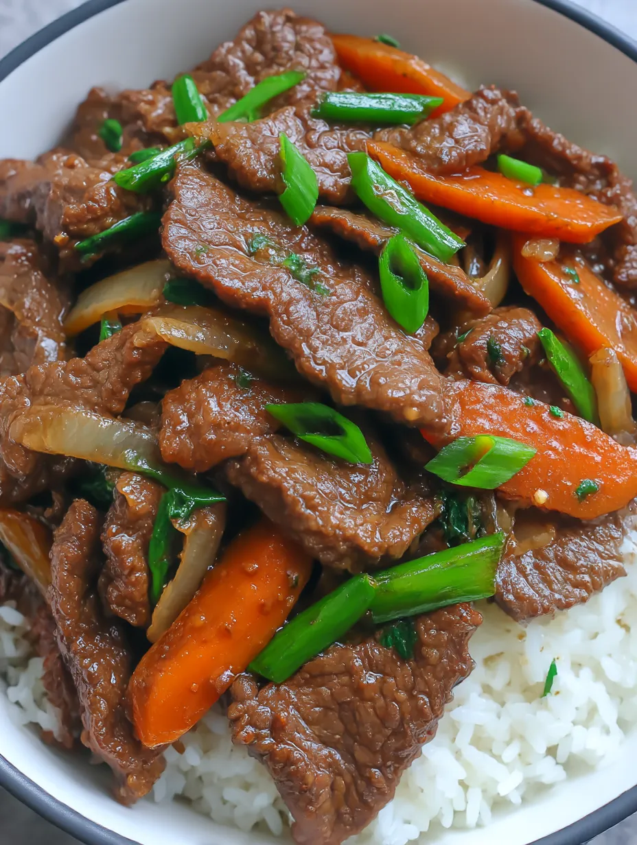 Super close view of saucy Chinese beef and onions.