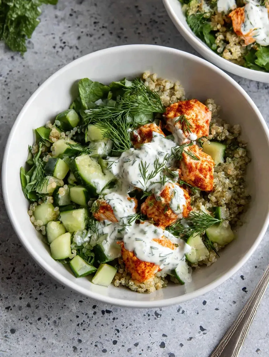 A white mug packed with onions, chickpeas, potato, zucchini, shrimp, and coconut milk.
