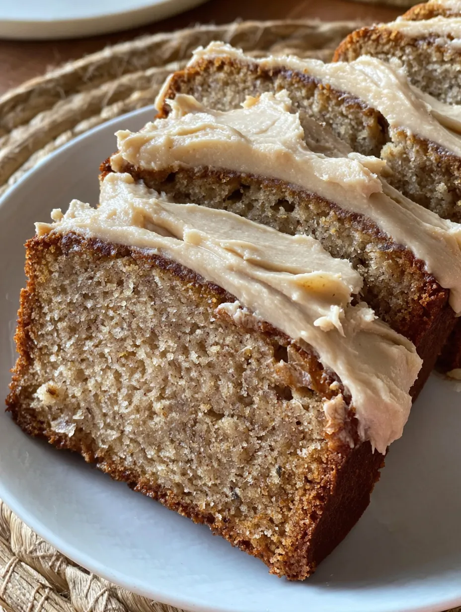 A board with sliced banana bread on a white plate.