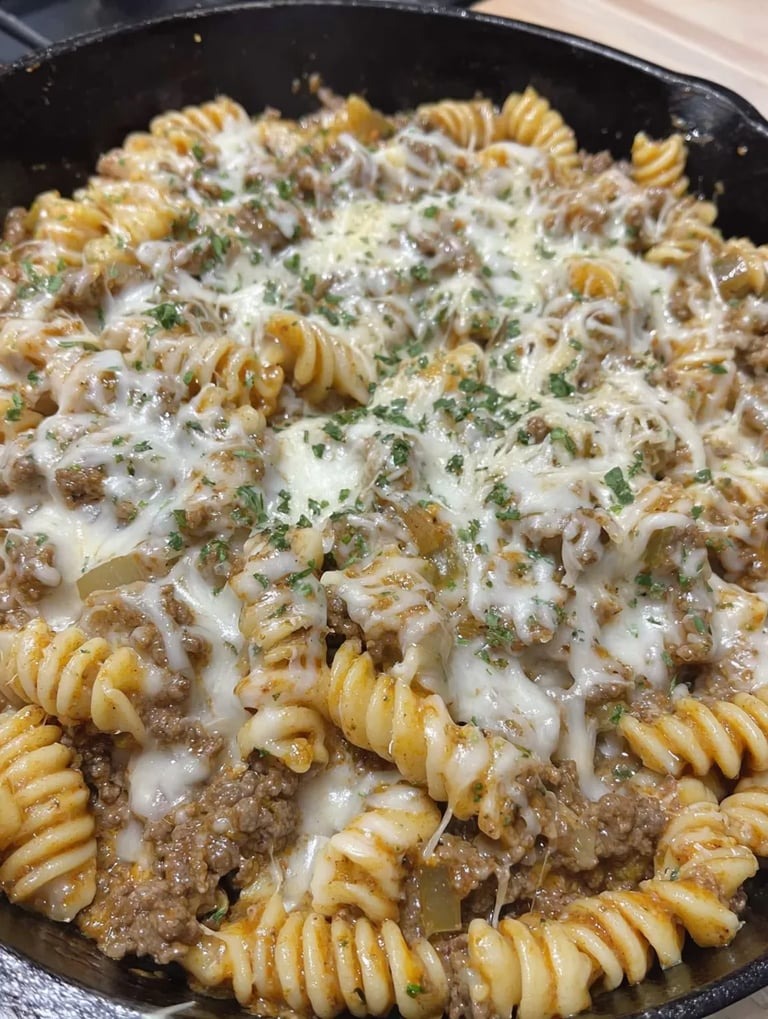 A bowl filled with pasta and beef.