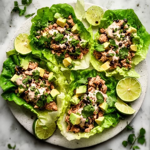 A plate of food with lettuce and meat.