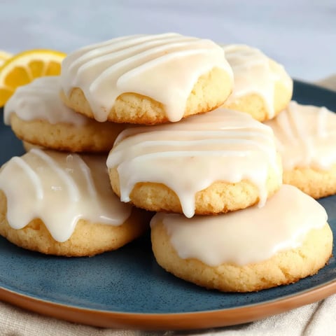 A plate of cookies with white icing.