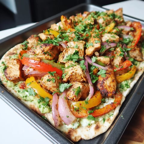 A pan of food with a variety of vegetables and meat.