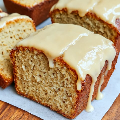 Banana bread slice with honey dripped on top.